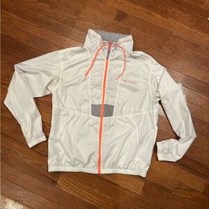 Columbia Flash Challenger Windbreaker in white with orange zippers and accents.